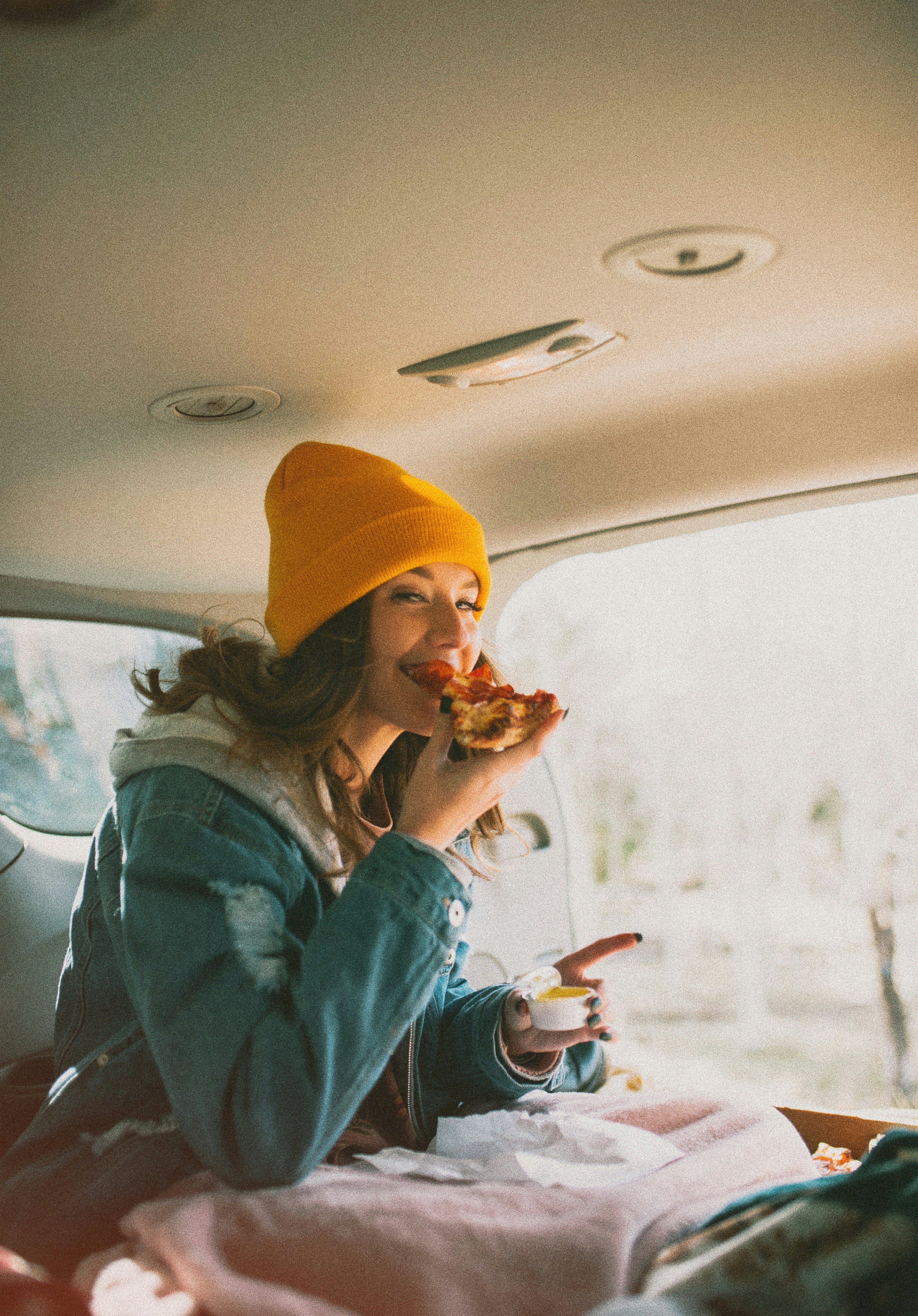Woman wearing yellow knit beanie — winter streetwear hat for women and men