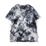 19 Tie-dye oversized t-shirt flat lay showing marbled dye pattern and side seam label