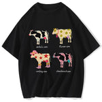 2 Flat lay of black cartoon cow print graphic tee showing full print and O-neck collar