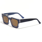 Sunglasses with blue frame and brown lenses on a white background, featuring the Caterside brand.