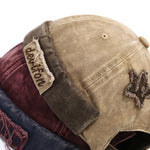 Model wearing acid wash brimless cap, side view