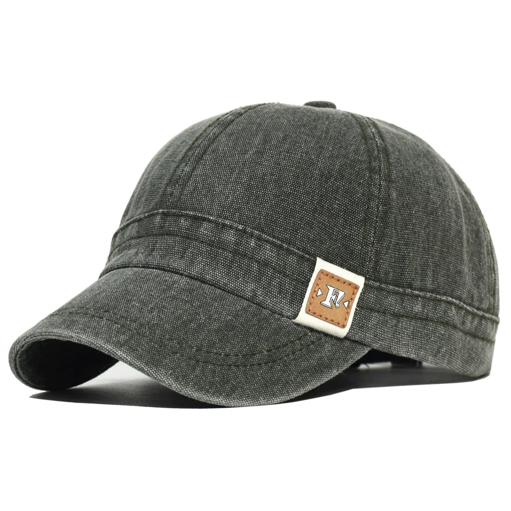 Army Green Acid wash short brim baseball cap — worn side view