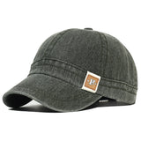Army Green Acid wash short brim baseball cap — worn side view