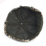 Back view of a cap with leopard print brim on a white background