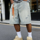 Baggy distressed denim shorts, front view