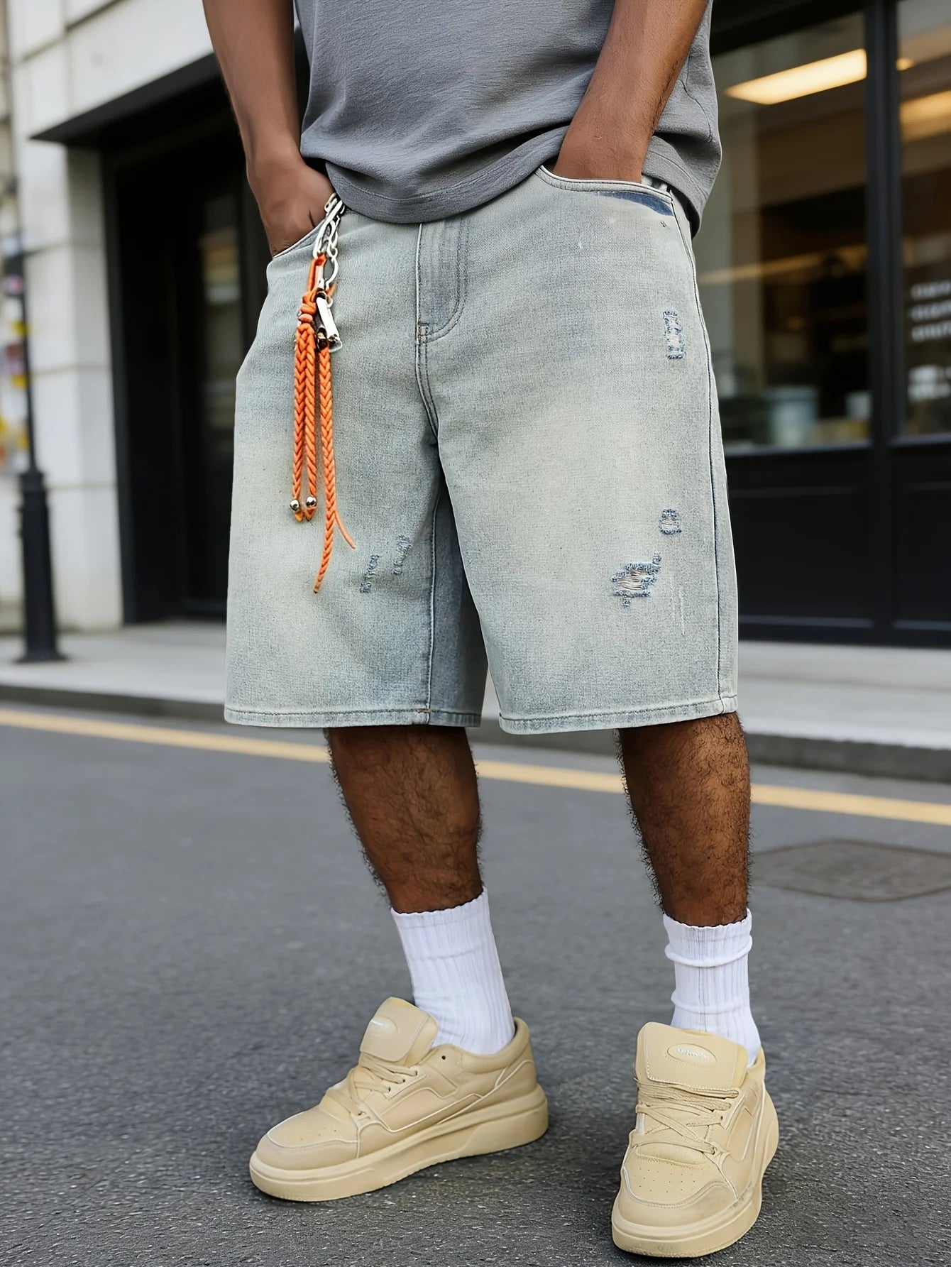 Baggy distressed denim shorts, front view