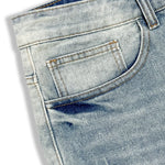 Baggy distressed denim shorts, side view