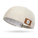 Beige Brimless corduroy docker cap flat lay showing crown shape
