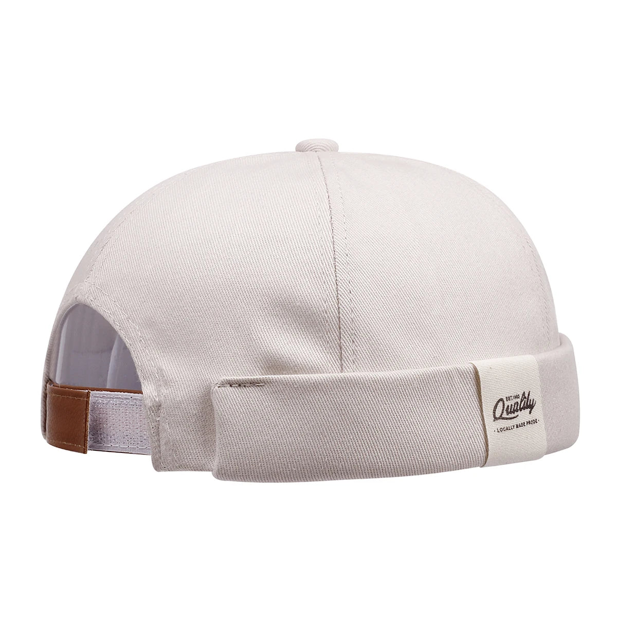 Beige Close-up of letter patch detail on brimless skullcap