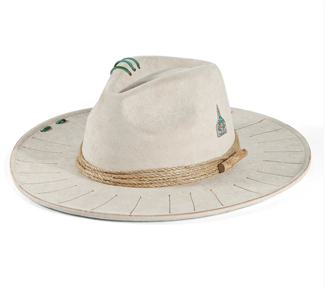Beige Close-up of wide brim edge on distressed cowboy hat showing texture detail