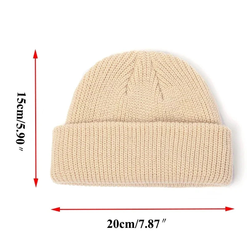 Beige knit beanie with measurements on a white background
