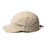 Beige cap with a drawstring on a white background