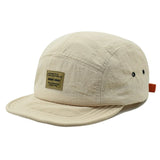 Beige Vintage short brim 5-panel cap — lifestyle shot, solid colorway