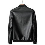 Black leather jacket on a gray background