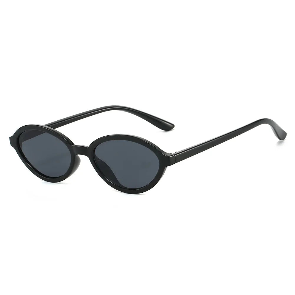 Black Black Close-up of gradient polycarbonate lens on small oval sunglasses — UV400 tint detail