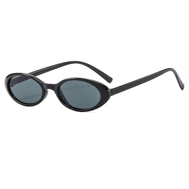 Black-Black Close-up of model wearing small oval cat eye gradient sunglasses