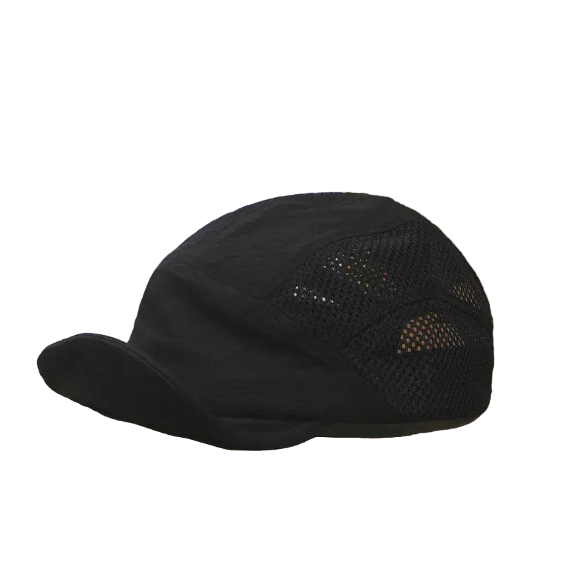 Black cap with mesh back on an open book