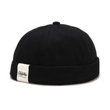 Black Brimless cotton skull cap, flat lay