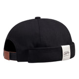 Black Model wearing brimless skullcap, angled on-head view
