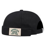 Black cap with 'Brooklyn New York' patch on a white background