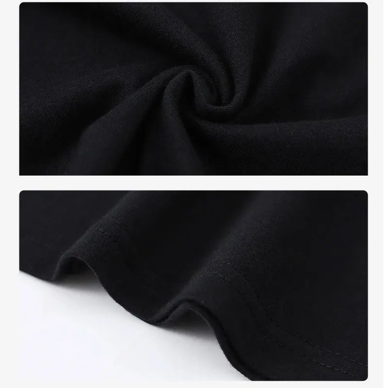 Close-up of cartoon cow graphic print on black cotton tee