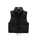 Black Cropped quilted puffer vest worn — side view