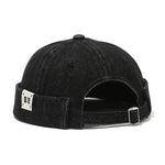 Black denim cap with a brand logo on the back on a white background