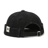 Black denim cap with a brand logo on the back on a white background