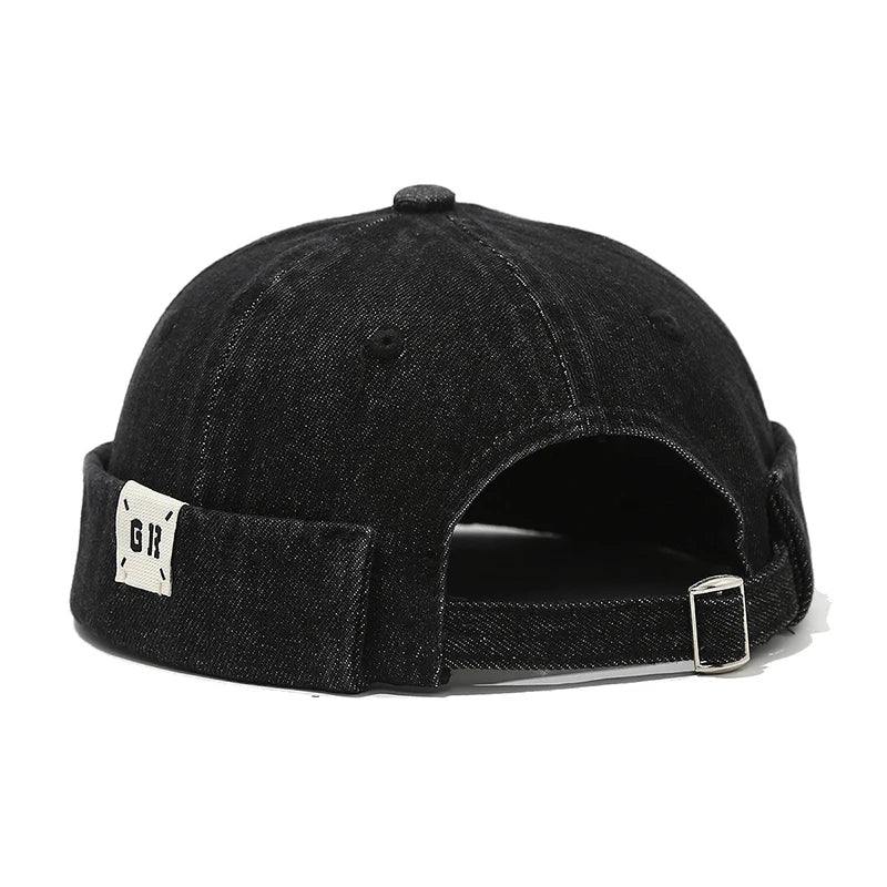 Black denim cap with a brand logo on the back on a white background