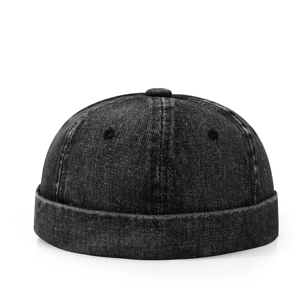 Black denim cap on a white background