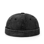 Black denim cap on a white background