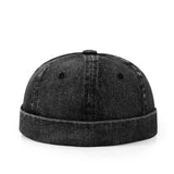 Black denim cap on a white background