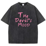 Black Devil's Mood washed oversized graphic tee — flat lay showing distressed print and crew neck