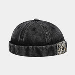 Black Distressed denim docker cap worn, angled view