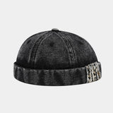 Black Distressed denim docker cap worn, angled view