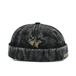 Black Distressed star brimless hat worn, back view