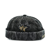 Black Distressed star brimless hat worn, back view