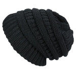 Black knitted beanie on a white background