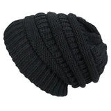 Black knitted beanie on a white background
