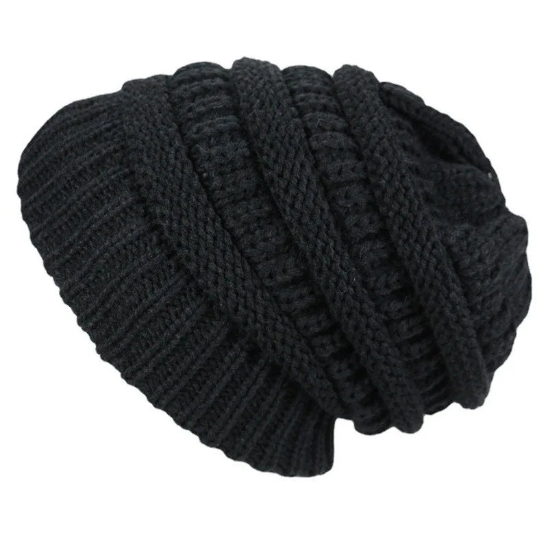 Black knitted beanie on a white background
