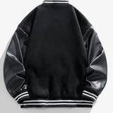 Black varsity jacket with white stripes on a light gray background