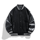 Black varsity jacket with leather sleeves on a white background