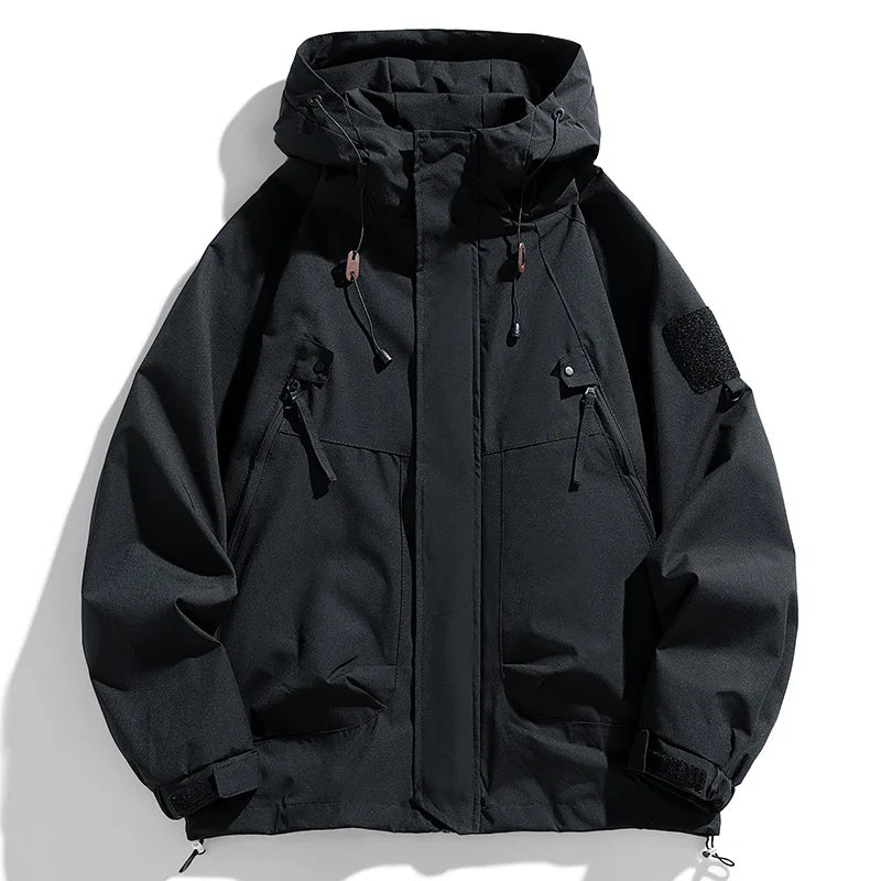 Black hooded jacket with multiple pockets on a white background