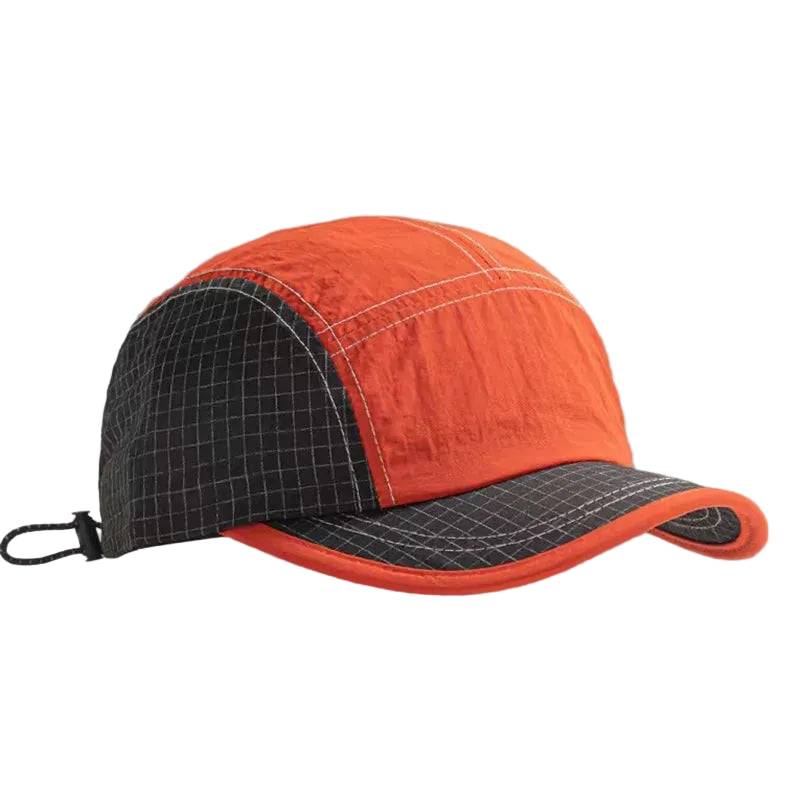 Orange and black cap on a gray background