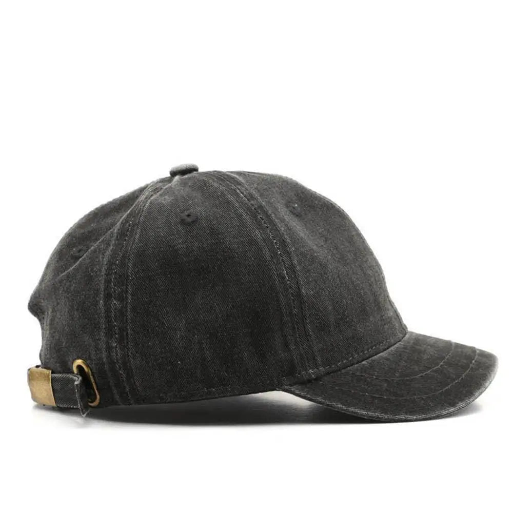 Black baseball cap on a white background with 'black' text above it.
