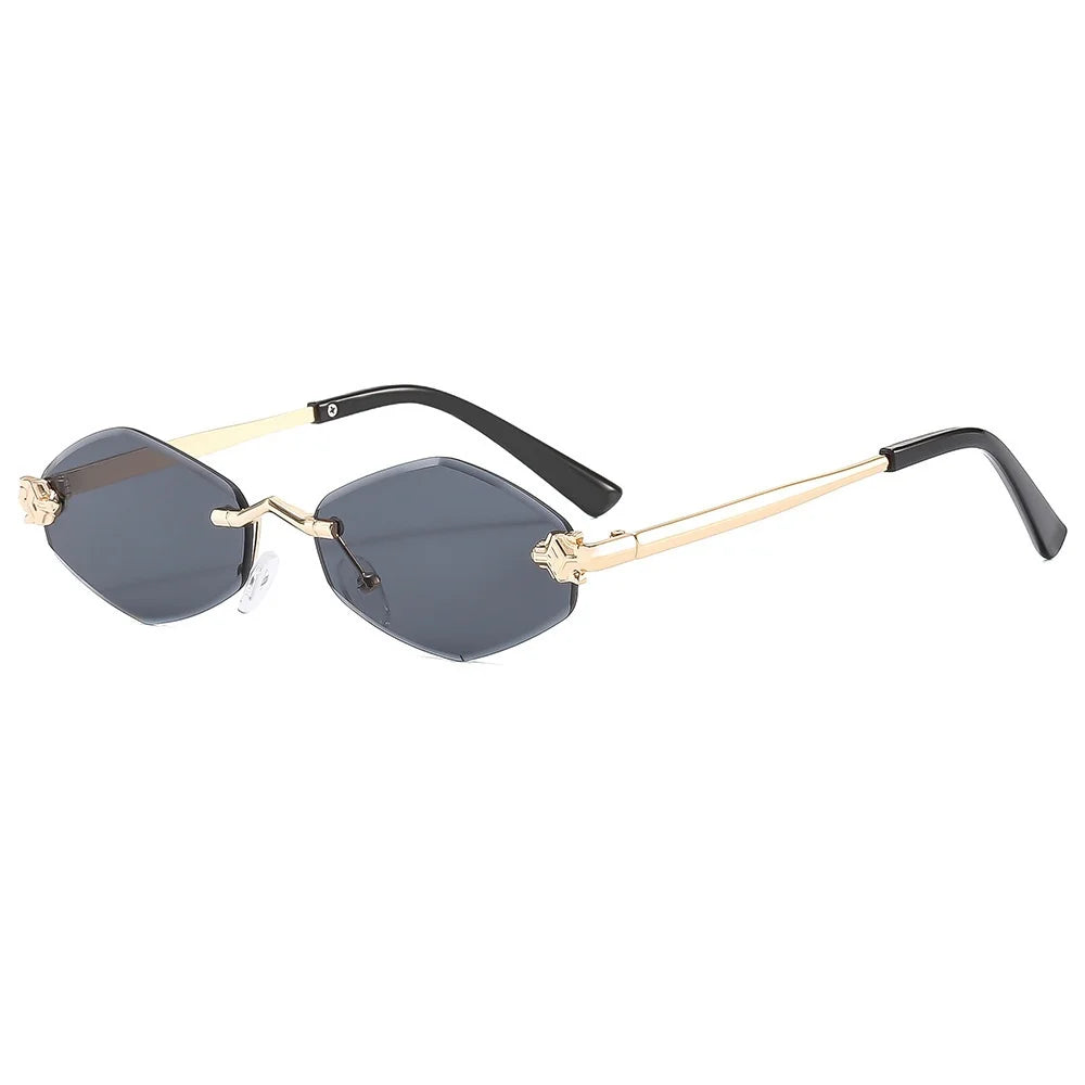 Sunglasses with gold frame and black arms on a white background