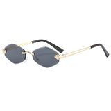 Sunglasses with gold frame and black arms on a white background