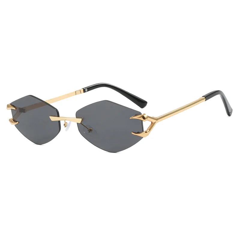 Gold-framed sunglasses with black lenses on a white background