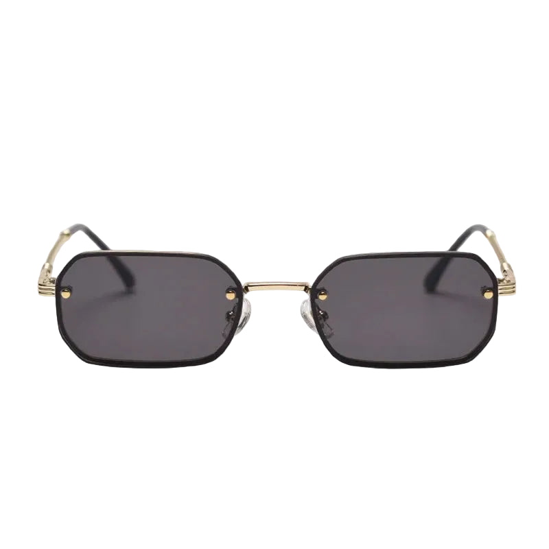 Sunglasses with gold frames and black lenses on a light gray background