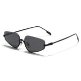 Gold-framed sunglasses with black lenses on a light gray background